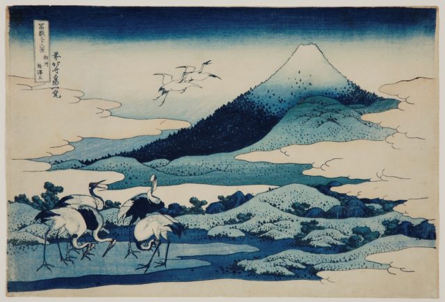 Mount Fuji with birds standing in front and in the air on left, all in shades of blue.
