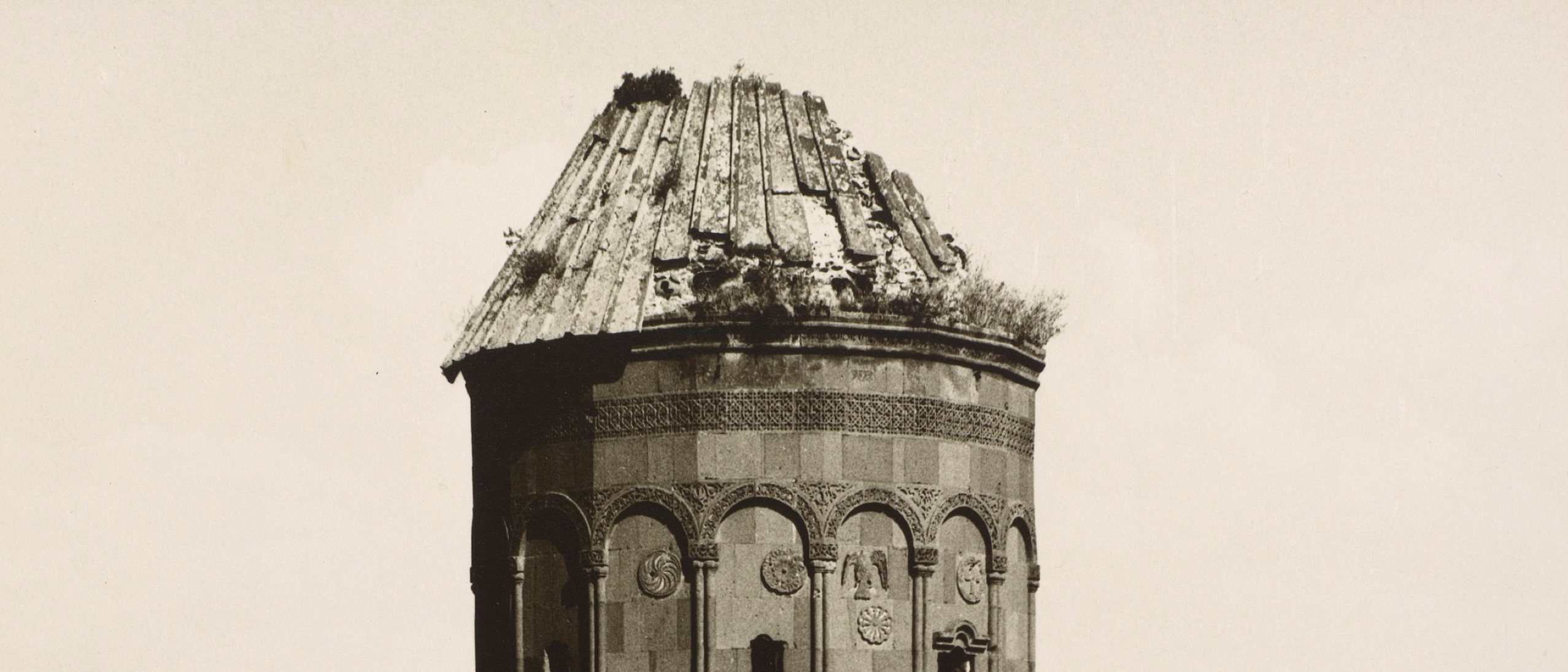 Detail of photograph showing the decaying roof or a run down church.
