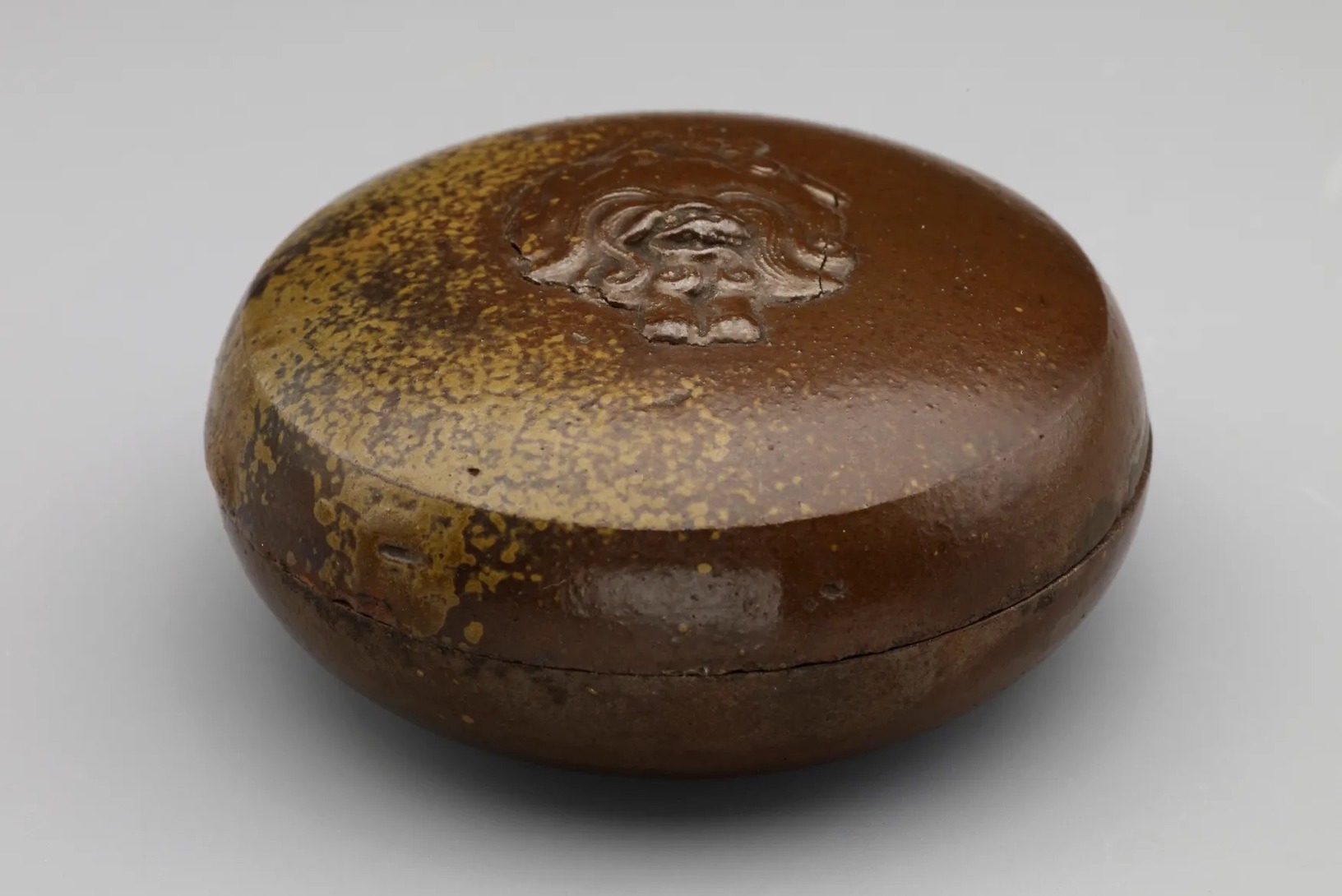 Incense box with relief figure of lion.