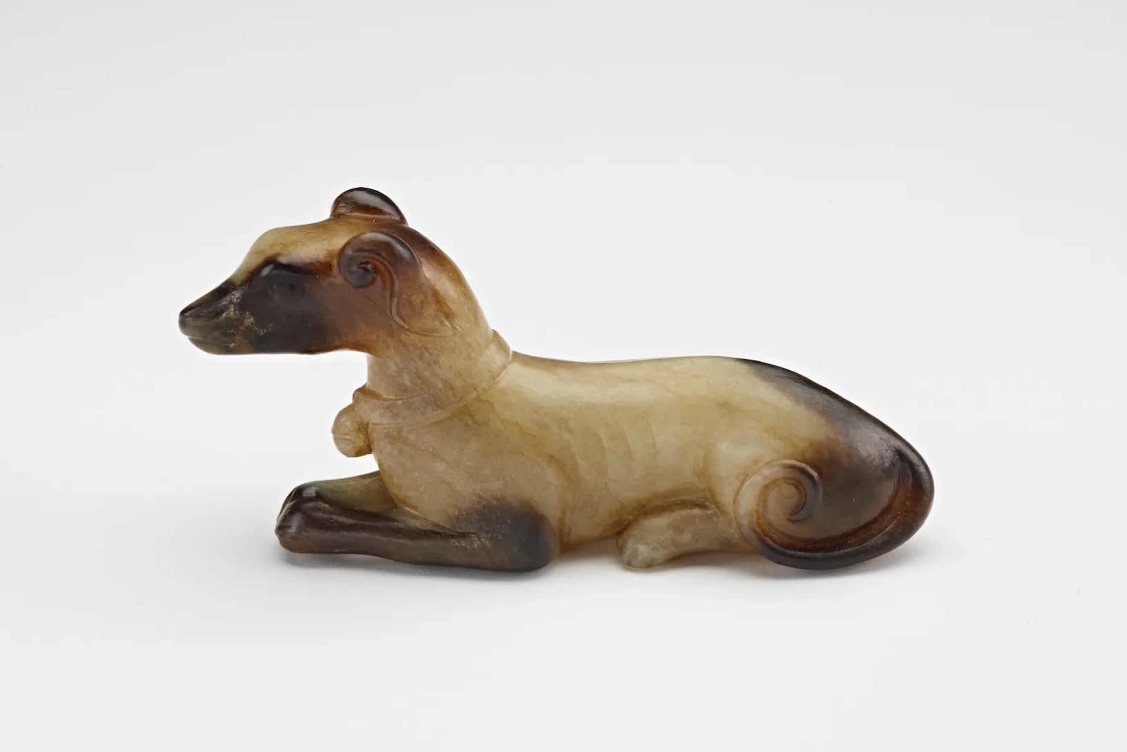 Tan and brown hound shaped object.