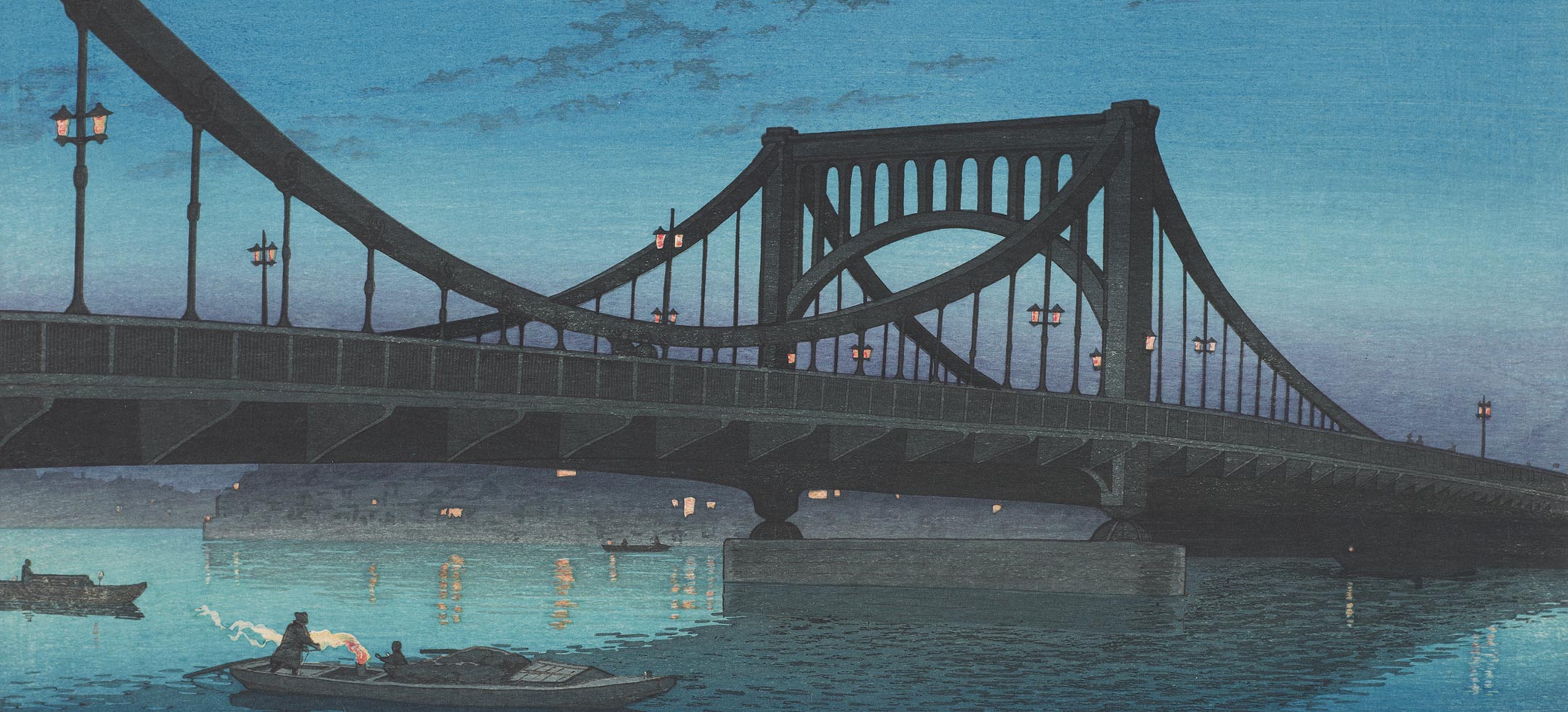 Printed image of a bridge over a river, against a dusky blue sky.