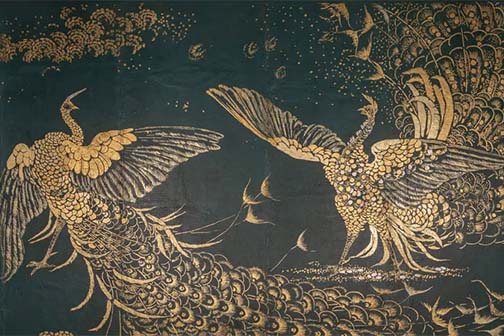 Two frilly peacocks fighting, rendered in gold on teal.