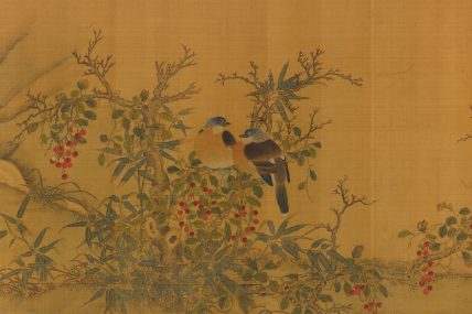 two birds in a tree full of berries