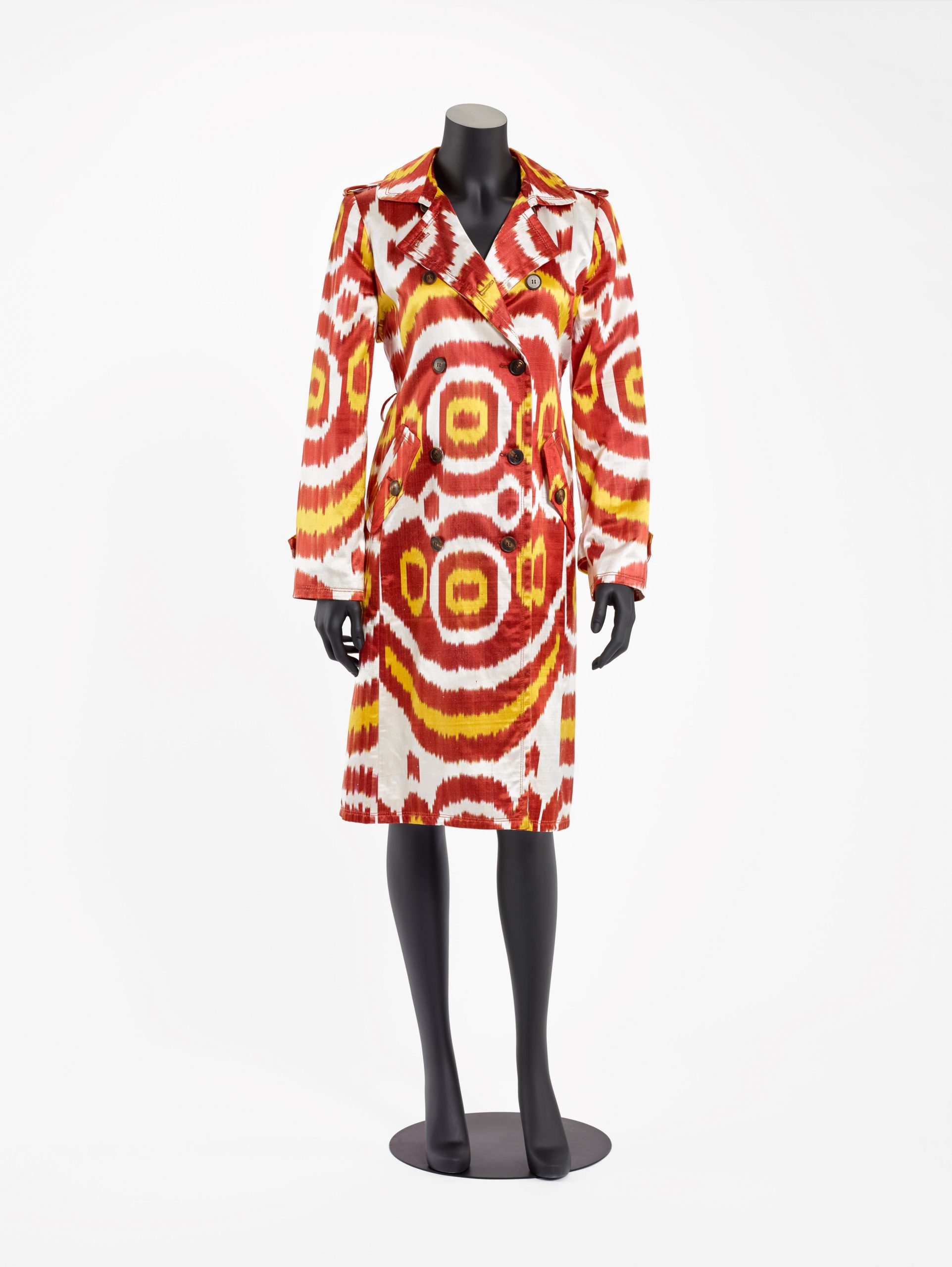 Trench coat with yellow and red designs.
