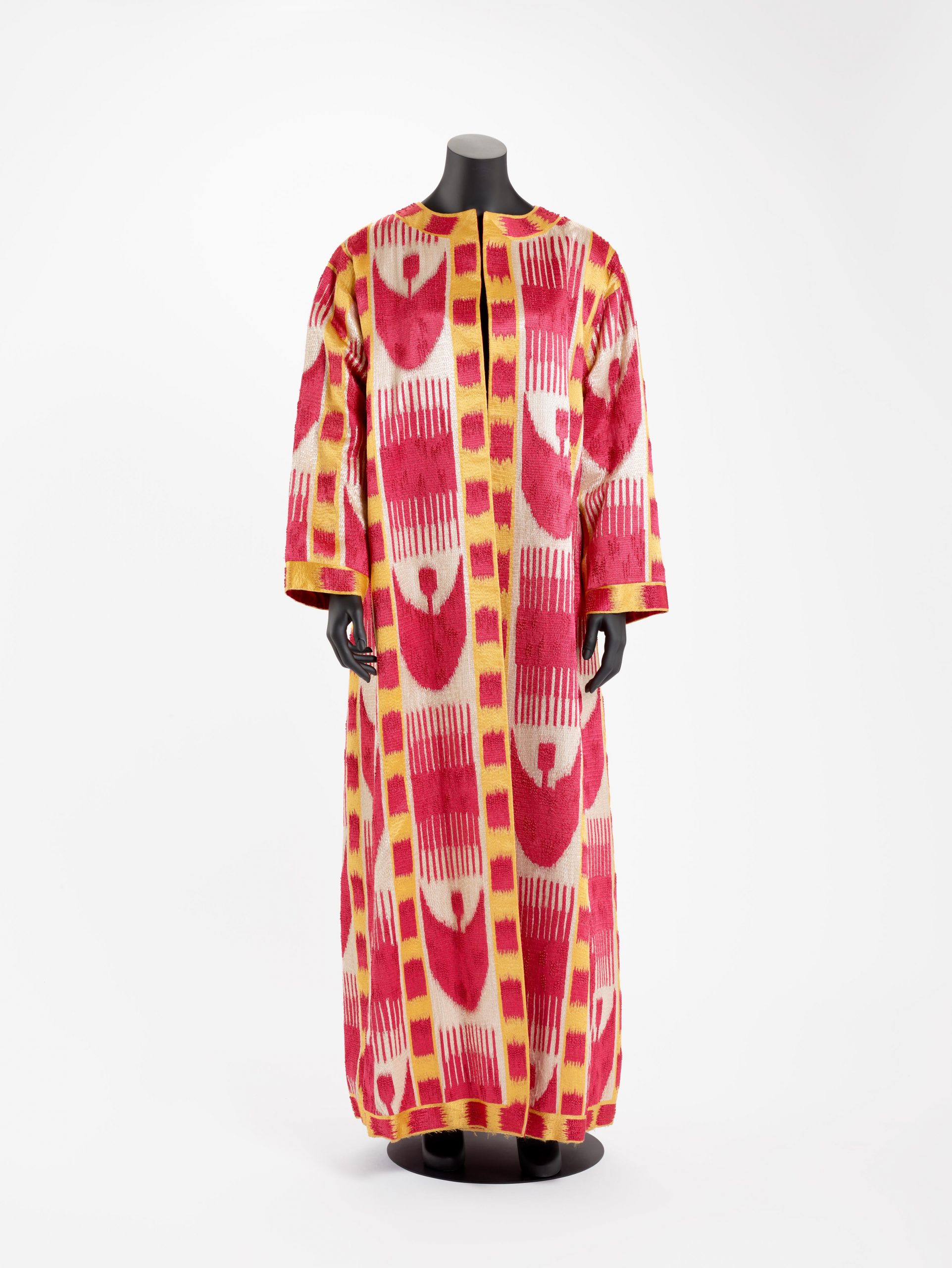 Long coat with large red crescents and comb design.