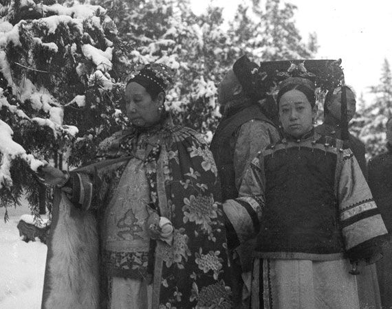 Cixi with various ladies and eunuchs in the snow.