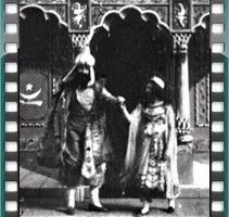 video still of magician Hindoo Fakir with a woman