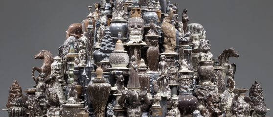 A mountain of brown and black glazed manufactured ceramic objects