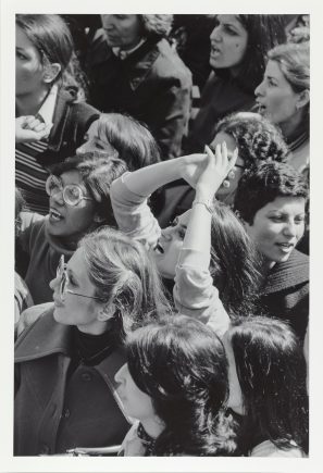 Black and white photo of a crowd of women at a street protest