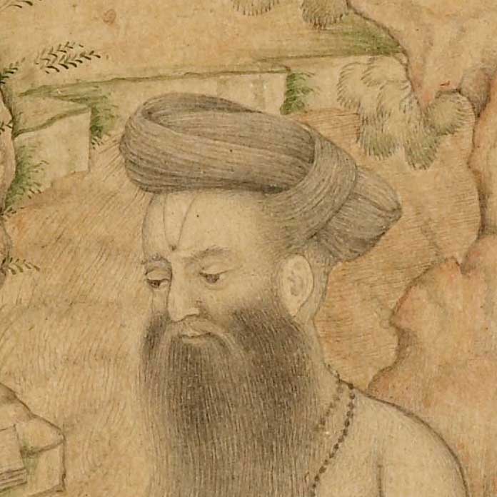 a man wearing a head turban with a marking on his forehead