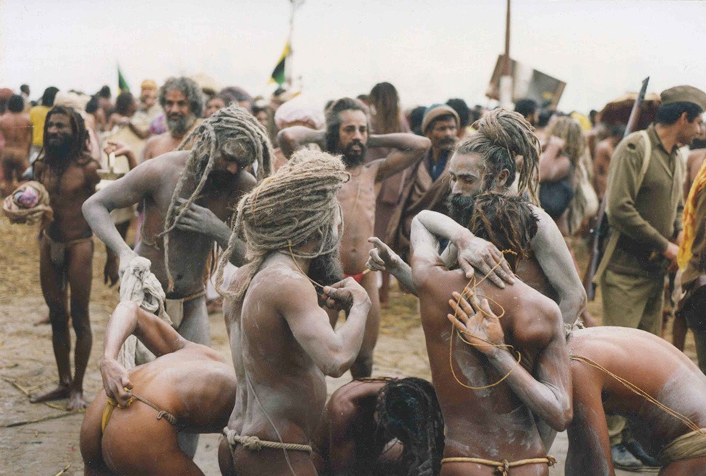 a group of men putting ashes on themselves