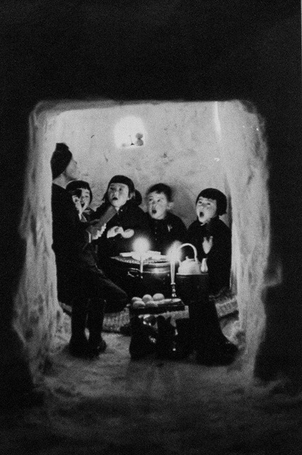 black and white photo of a group of children singing