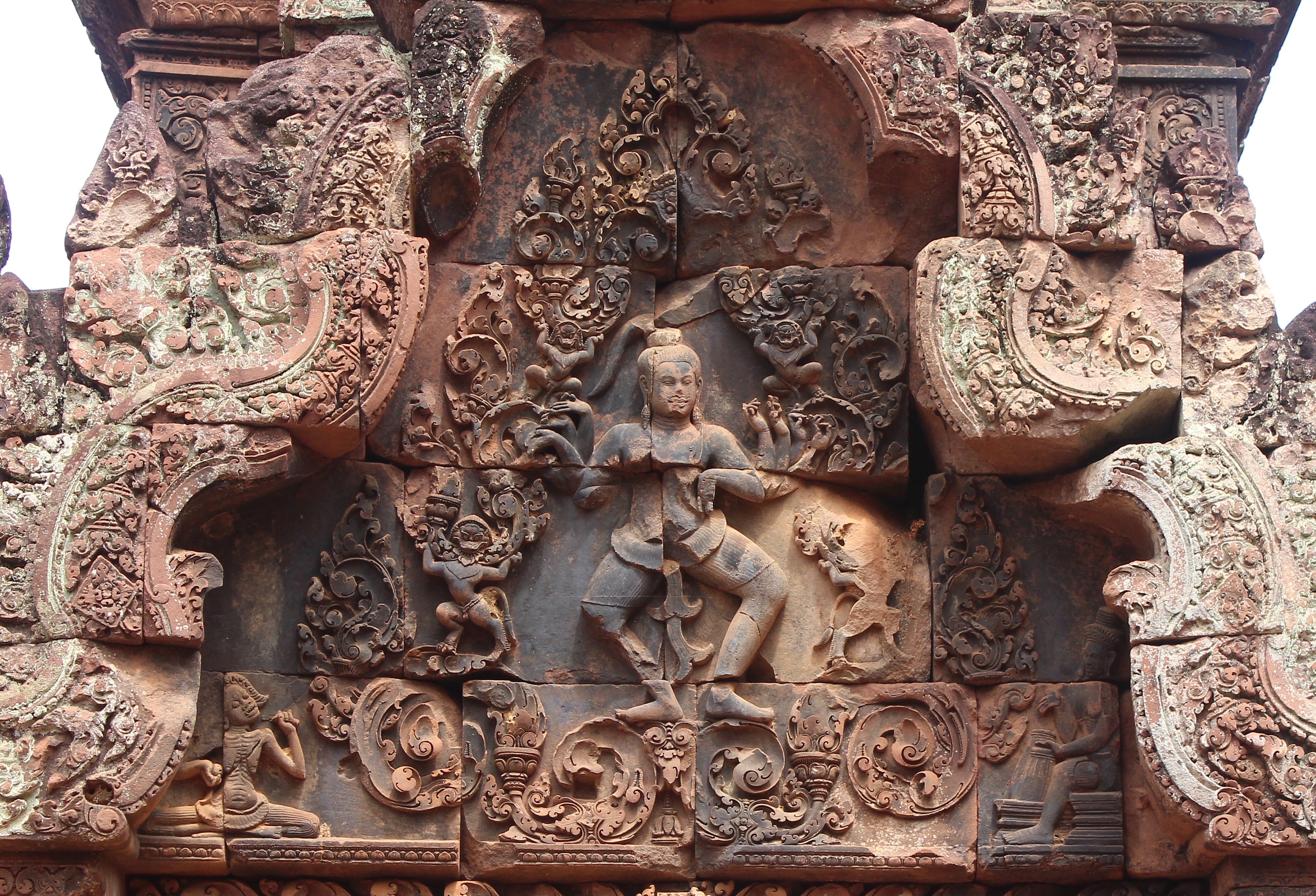 Closeup of relief showing dancing Shiva in a cusped niche