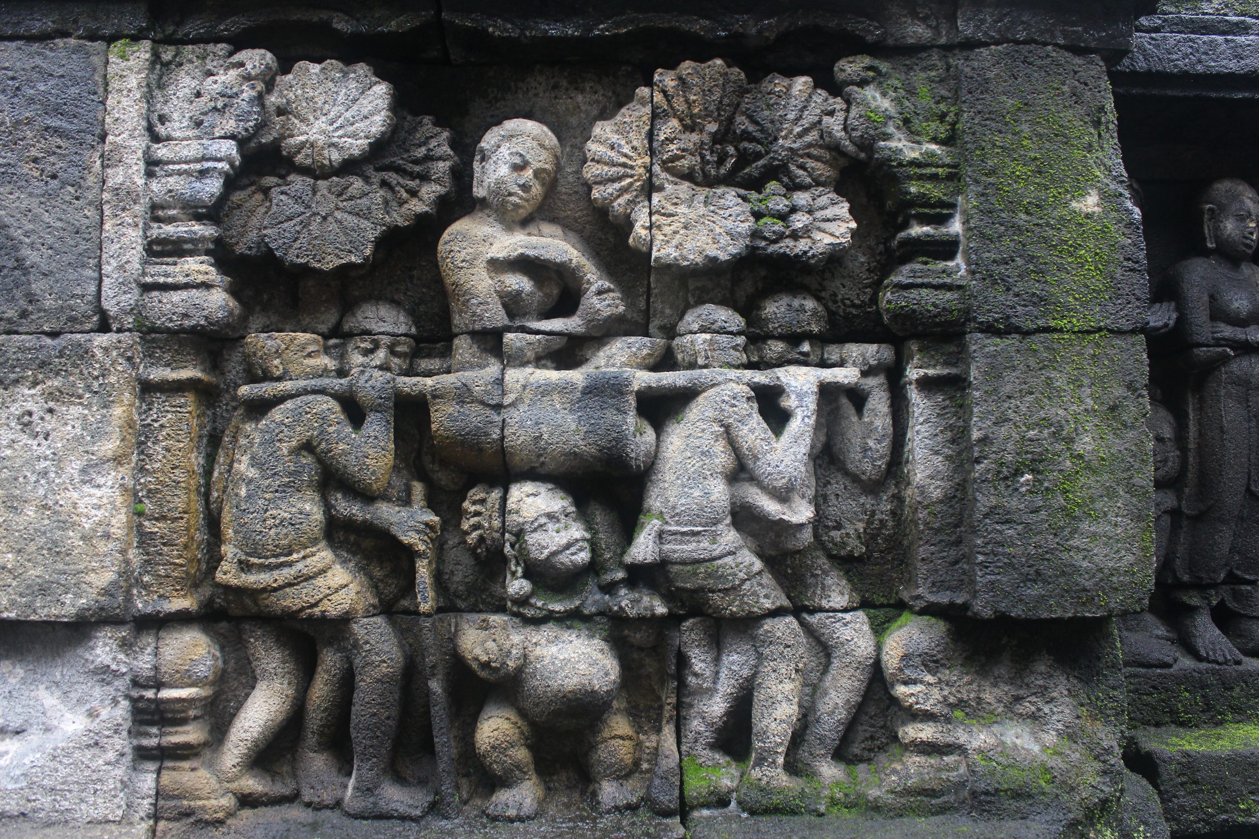 Relief showing figure carried in a palanquin