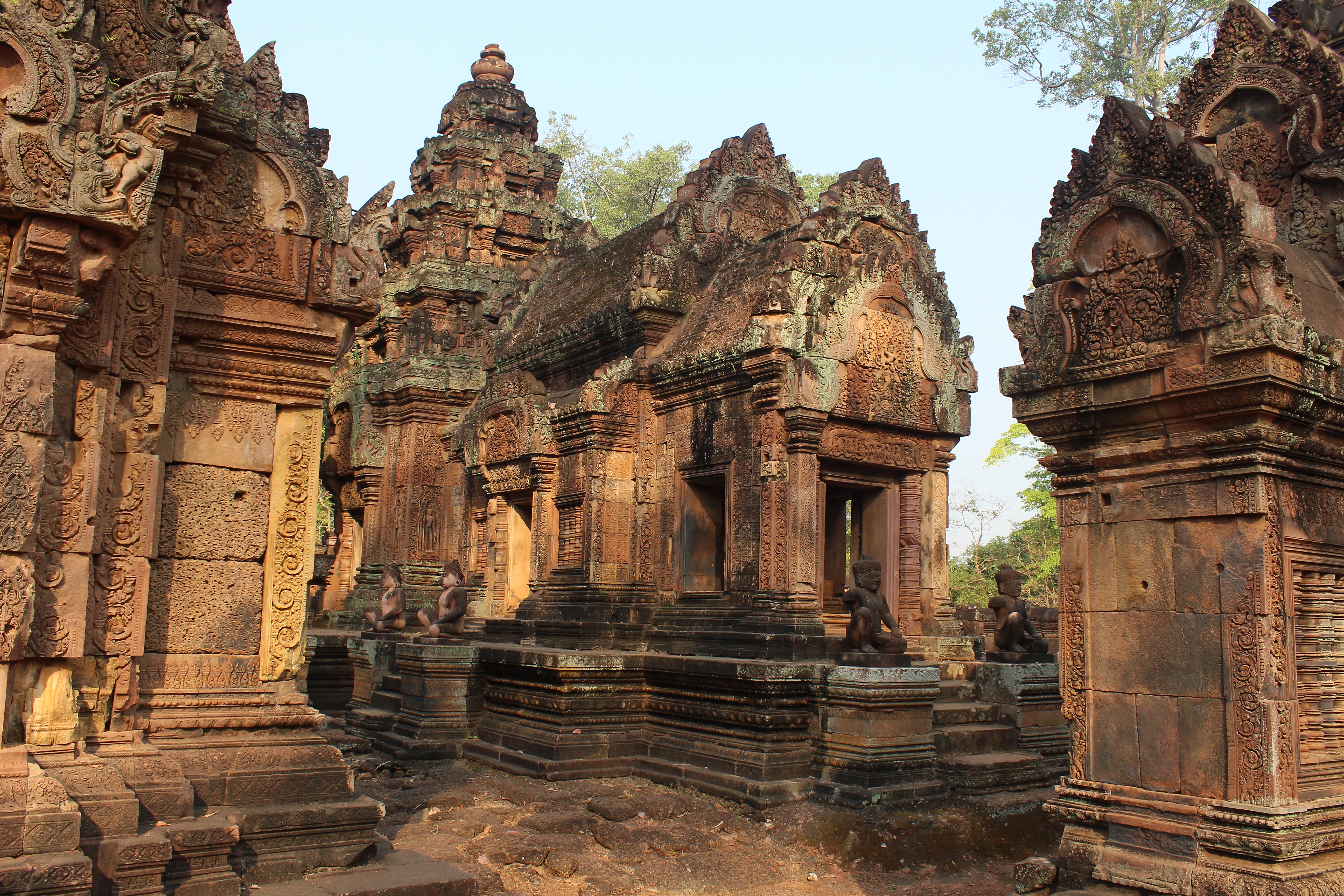 Multi-shrine temple with pointed arches and intricate carvings on the façades