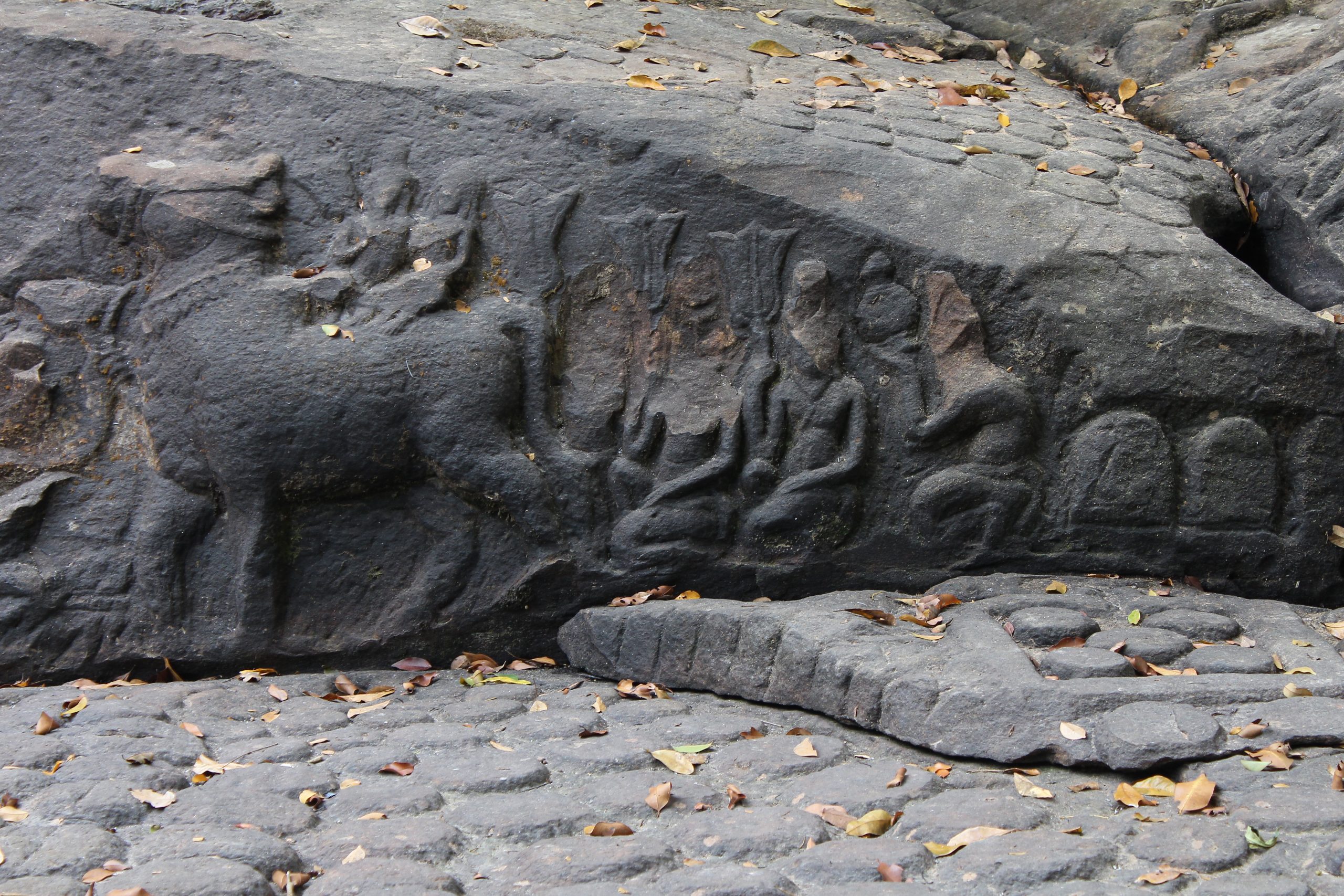 Relief carving of Shiva and Uma on Nandi with ascetics