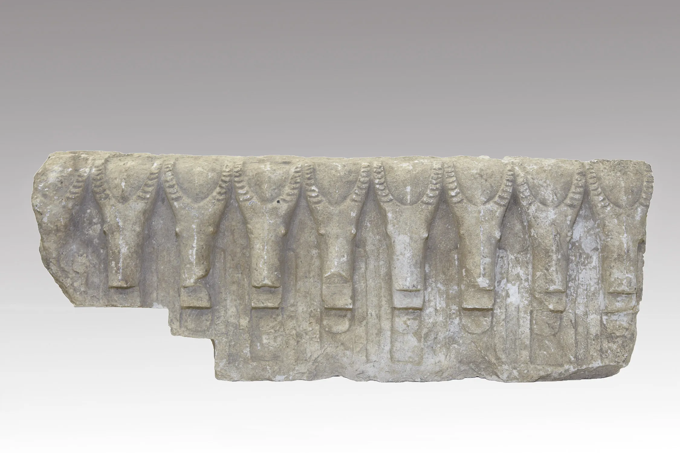 a broken rectangular frieze with a pointed decoration