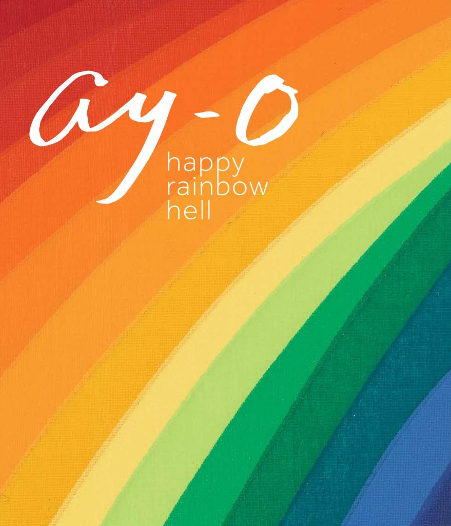 White text placed against a striped rainbow background. Stripes of color curve diagonally across the book cover, transitioning from red in the top left corner to orange, then yellow, then green, and finally dark blue in the bottom right corner. Across the top left quadrant, “Ay-O” appears in a large script font with “happy rainbow hell” arranged below that in a smaller, lightweight sans serif font.