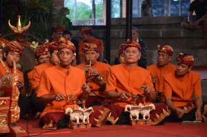 Section of gamelan ensemble including cymbal and flute players.