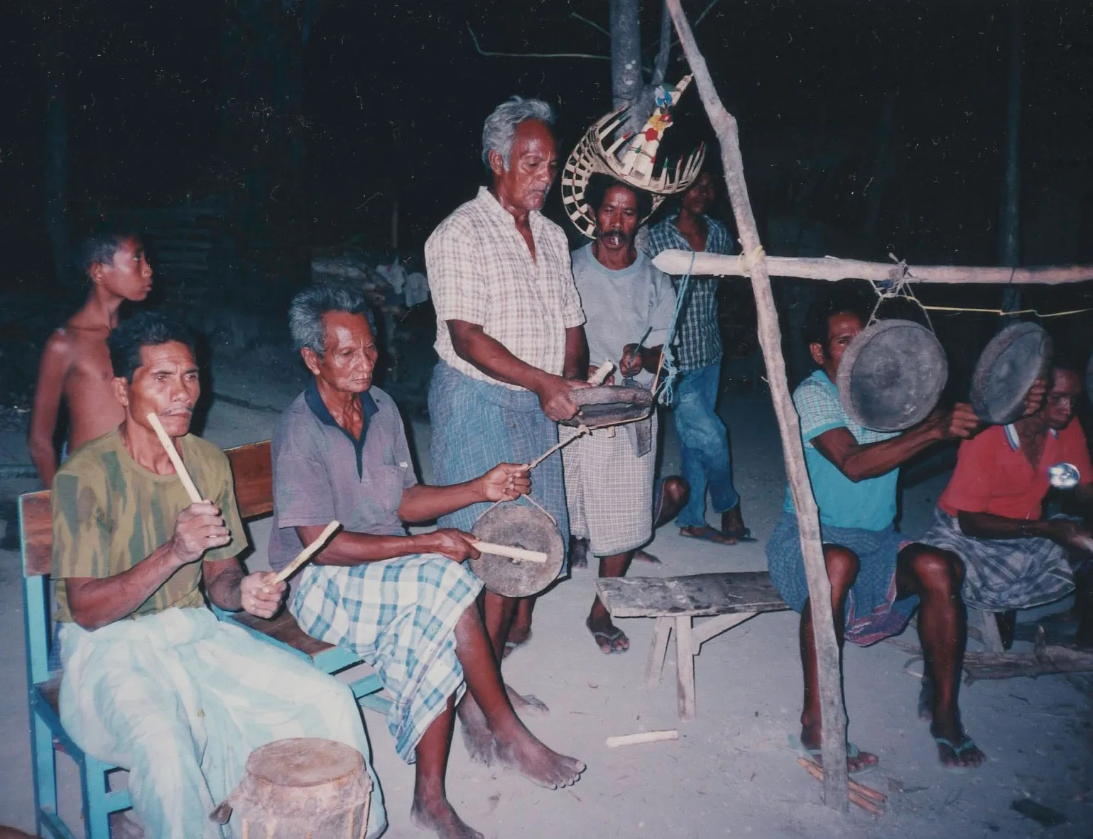 Men playing drums and gongs.