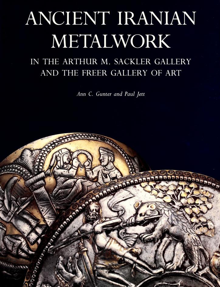 Ancient Iranian Metalwork book cover. Cover image: Close-up details of two overlapping, rounded metalworks in shades of silver and gold against a black background. The detail in the foreground depicts a figure fighting a large cat-like creature with a spear.