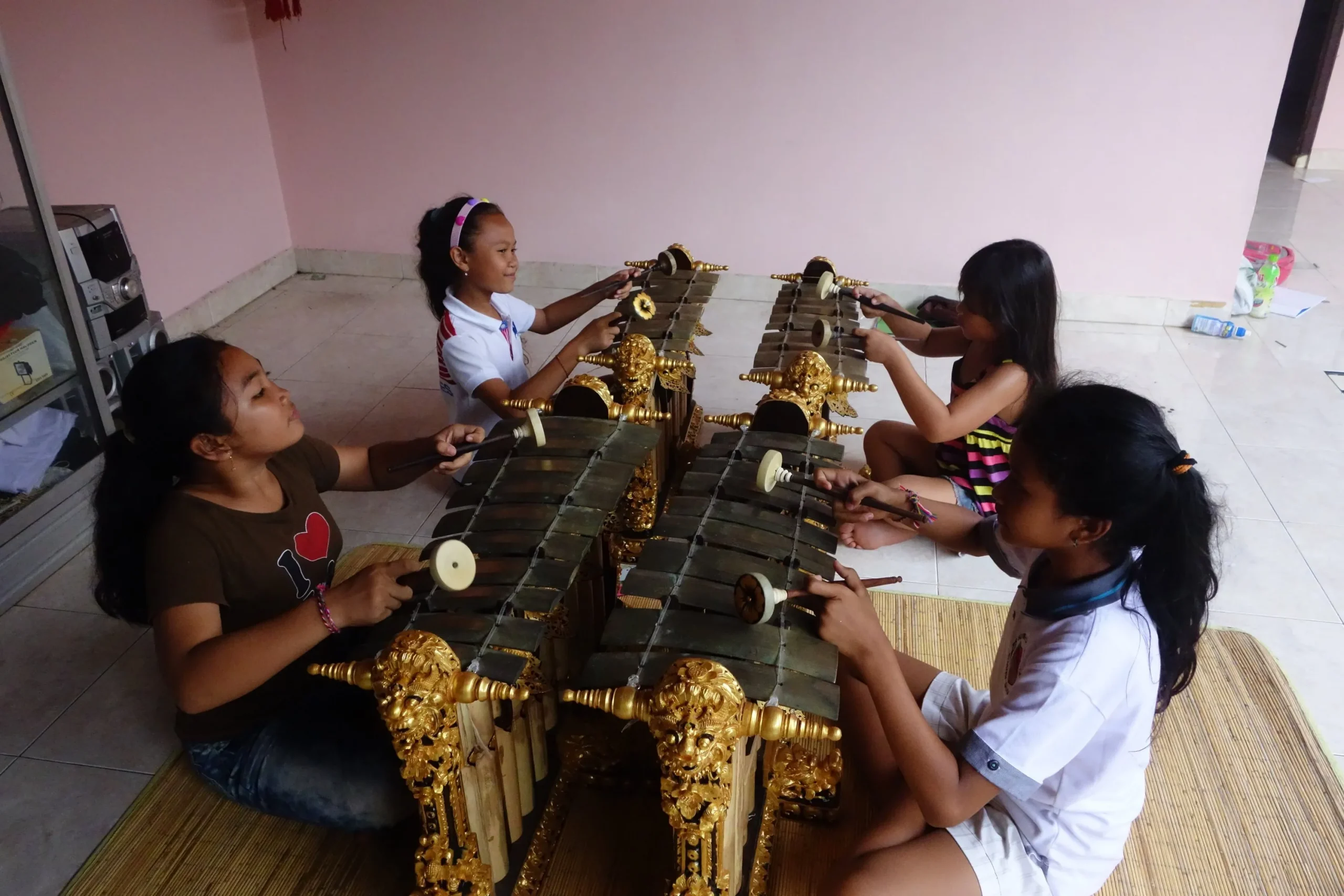 Four girls playing gender bells.