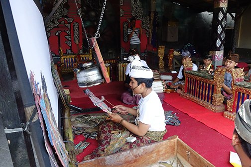 Young gamelan player rehearsing.