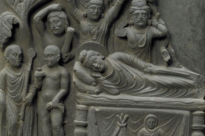 Scenes from the life of the Buddha. The relief shows the Buddha lying on his right side, a depiction of his final passing into Nirvana.