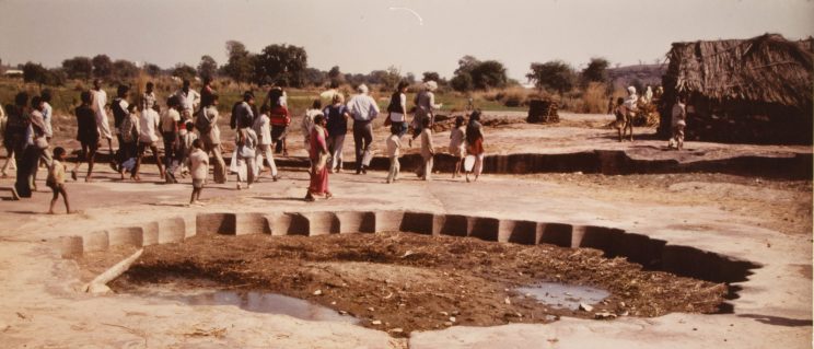 a group of people walking near Babur’s Lotus Garden in Dholpur