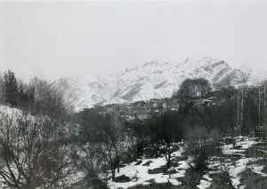 Houses in front of snow-covered mountains in Afghanistan