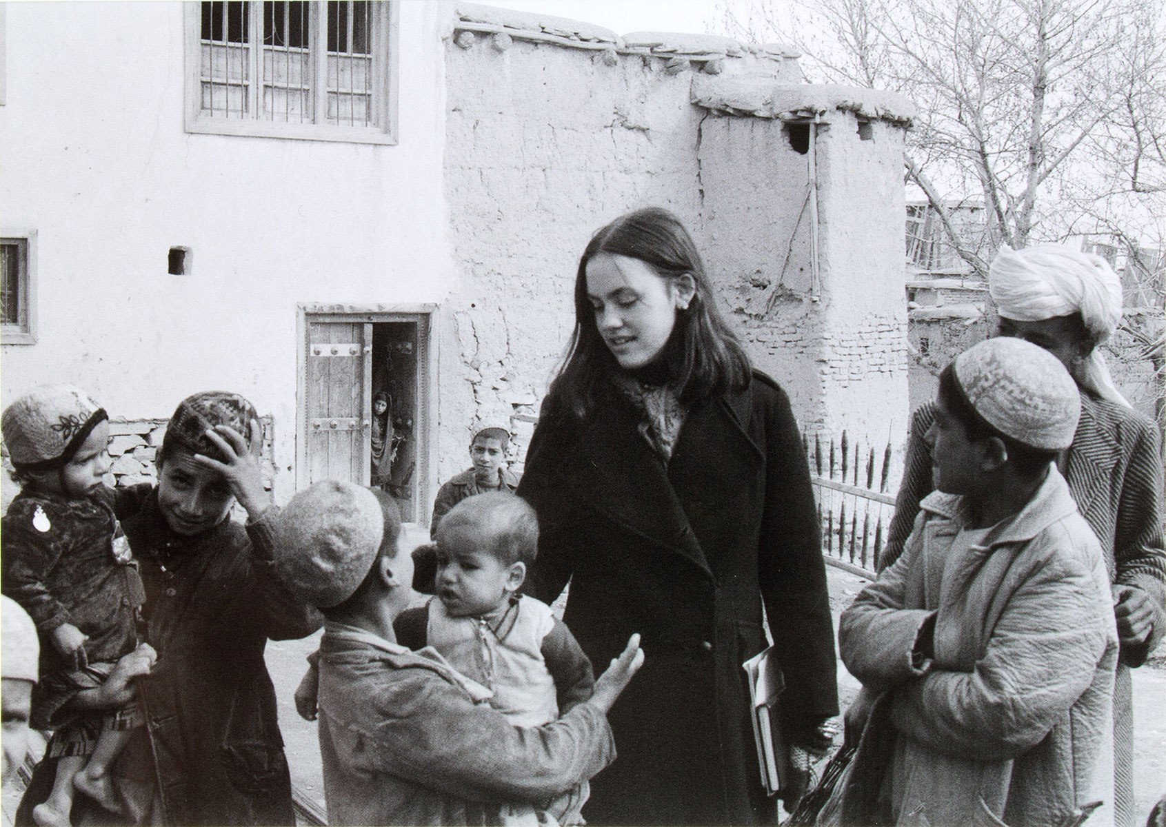 a woman and a group of children