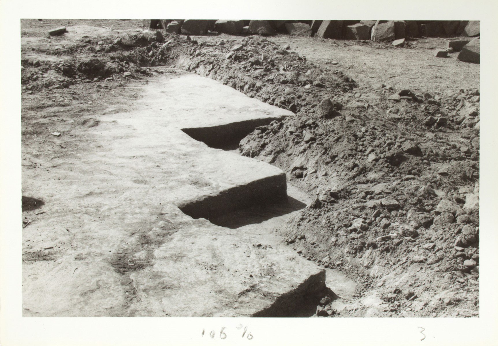 photograph of zigzag carved stone ground