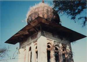 photograph of a shrine with a decorative round structure on top