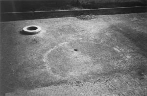 photograph of a court yard, and the outline of a large octagonal pool