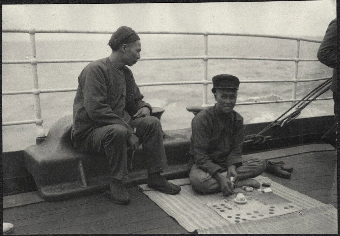 Chinese passengers aboard the Manchuria, playing a gambling game