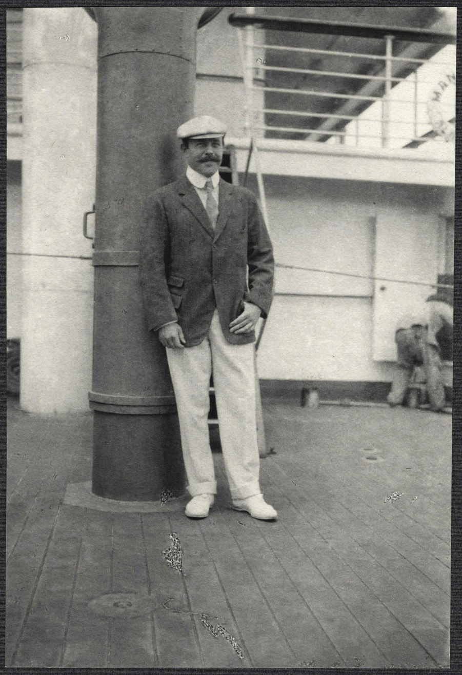 Nicholas Longworth Standing by a Smokestack on board the SS Manchuria.