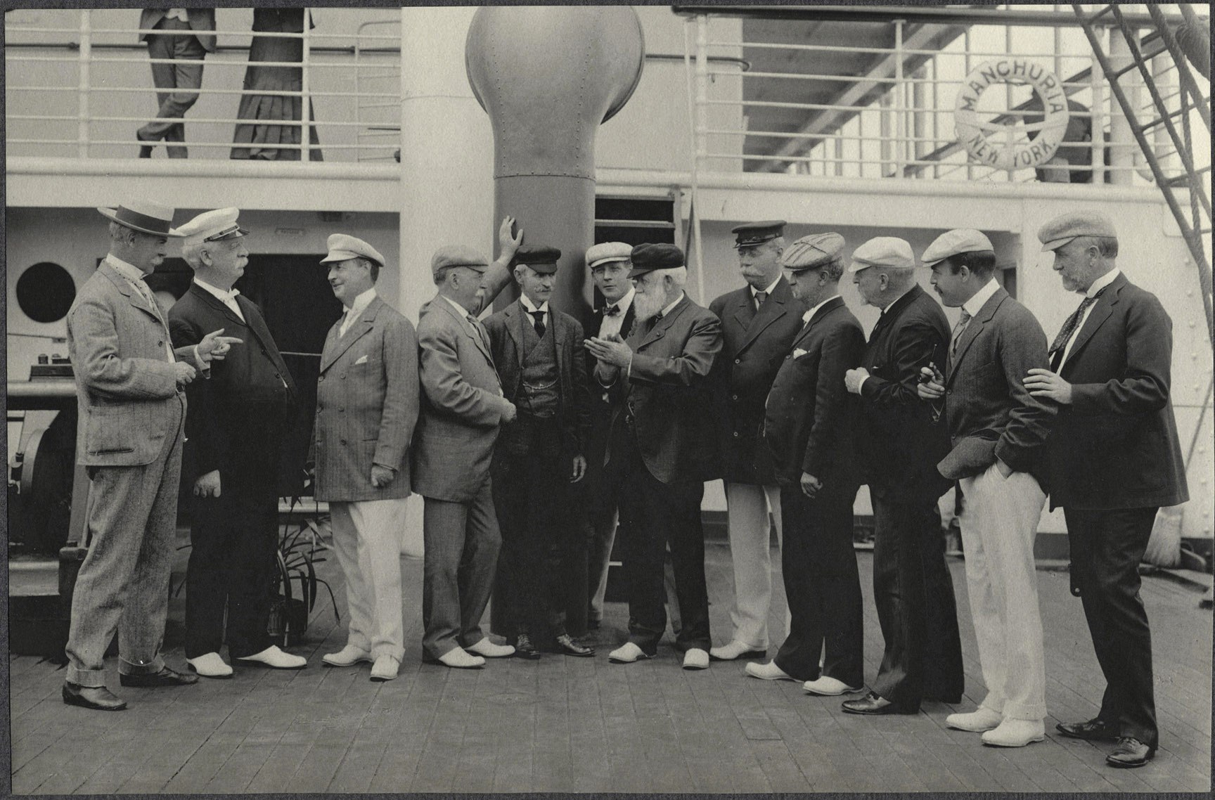 Male members of the Delegation conversing on deck the SS Manchuria.