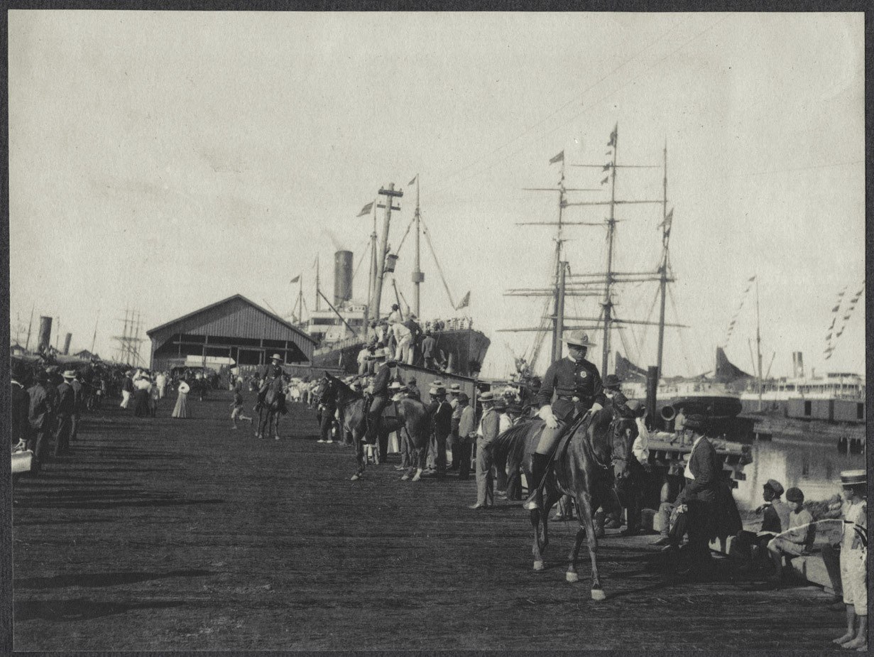 Honolulu dock with soldiers on horseback