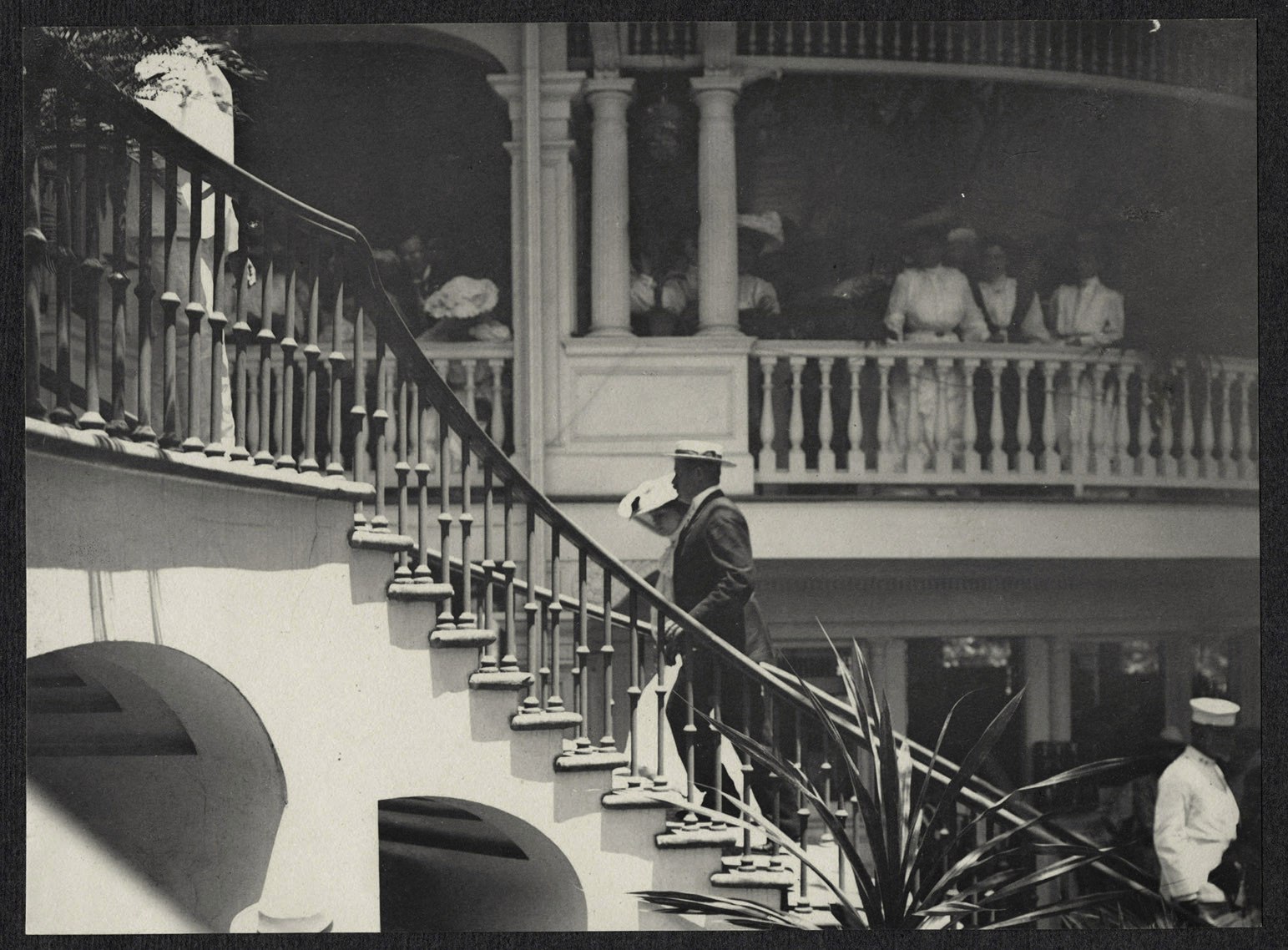 Onlookers watch Alice Roosevelt ascend a staircase