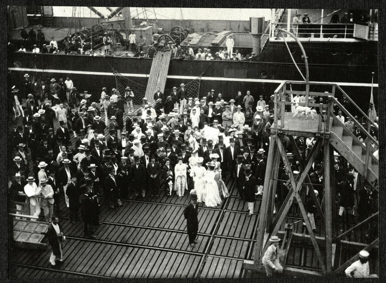 Yokohama: Dignitaries in top hats await SS Manchuria passengers