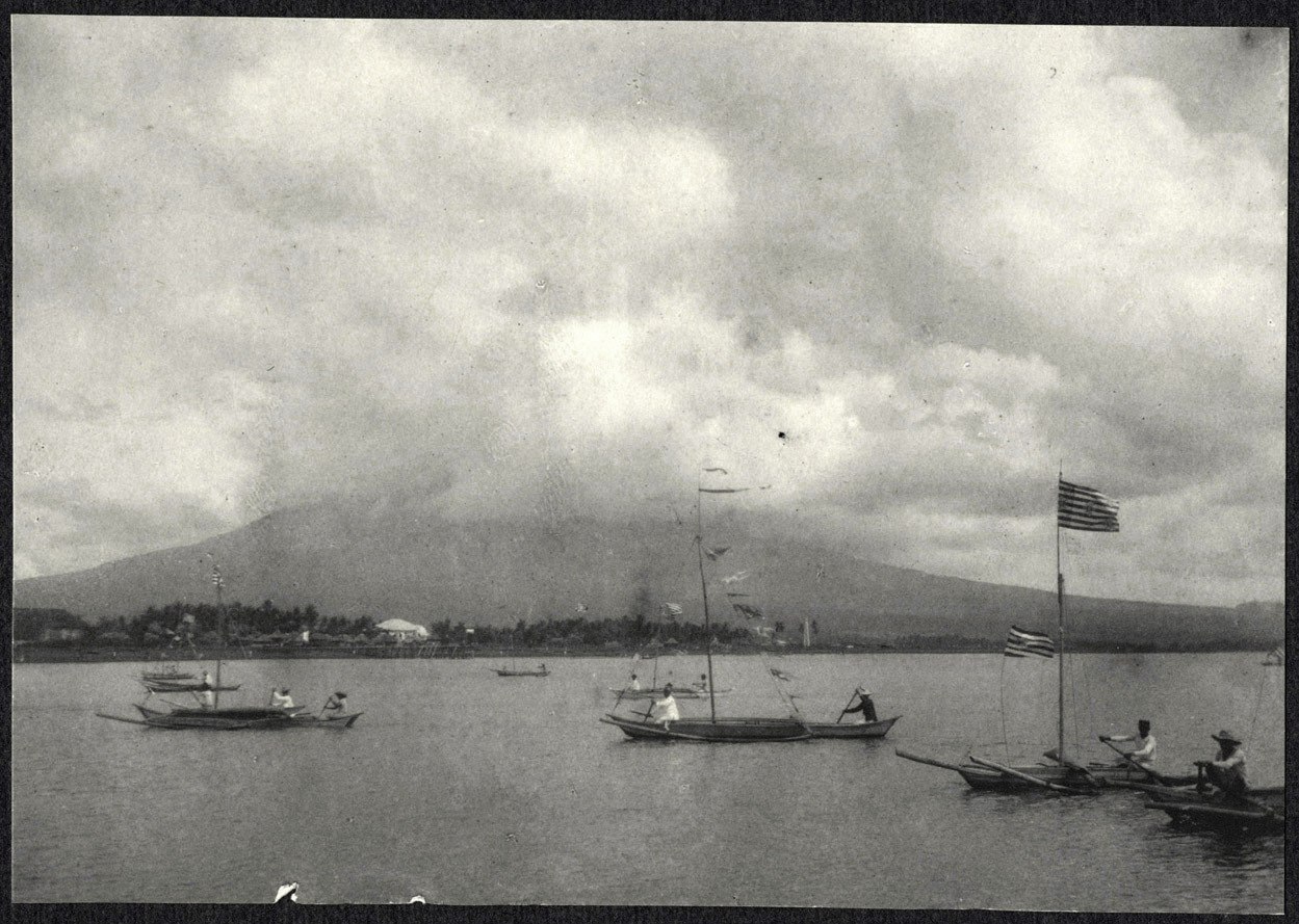 Legazpi: Small boats in harbor, with Mayon Volcano in the distance