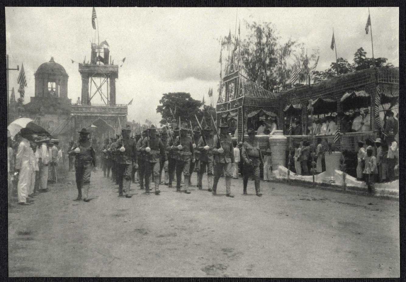 Legazpi: Troops march past a parade reviewing stand