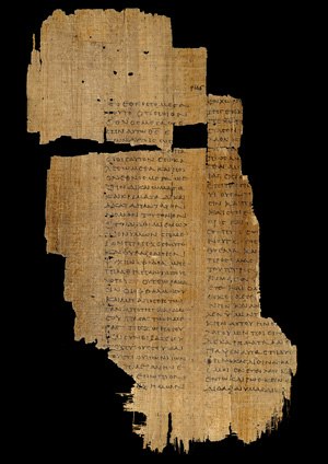 An ancient, almost shredded papyrus codex.
