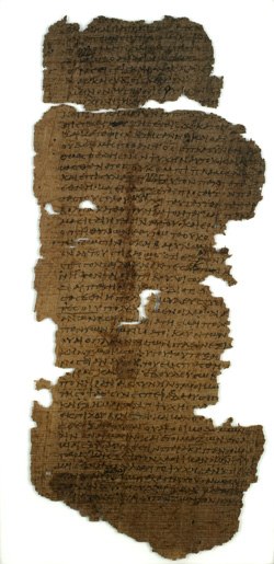 A dark brown papyrus codex, very old and in pieces.