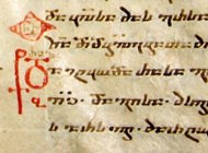 Stained and worn gospelbook, open