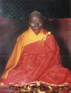 seated mummy in monk's robes