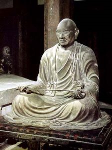seated sculpture of a monk