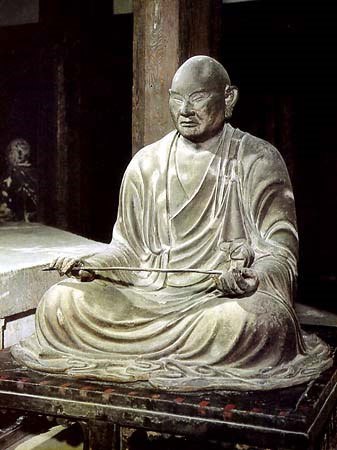 seated sculpture of a monk