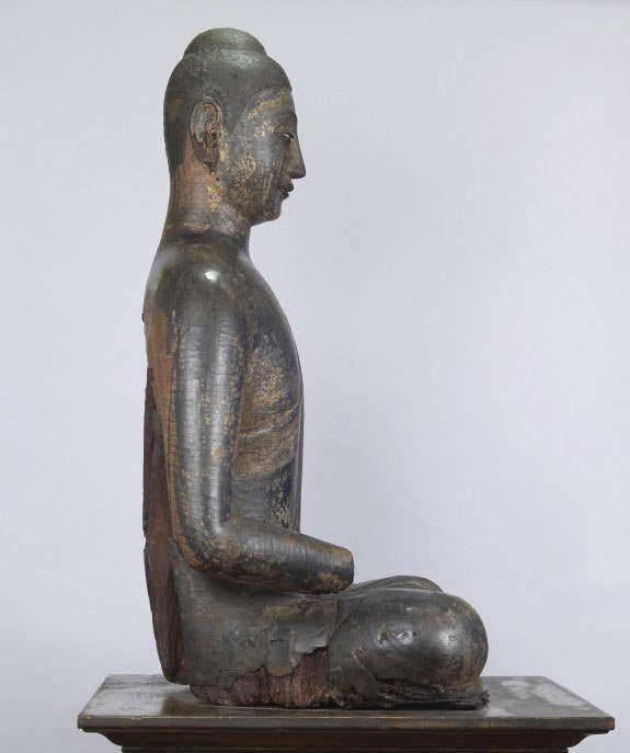 side view of a seated buddha