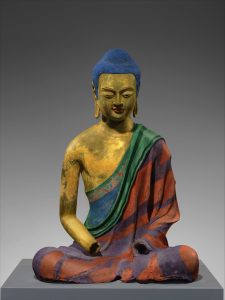 image of a buddha with colors added to speculate on the colors it may have had when it was new